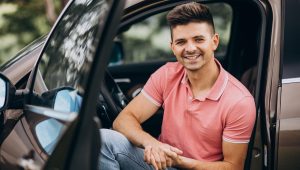 young-handsome-man-sitting-car-scaled.jpg