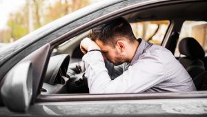 young-man-sitting-car-very-upset-stressed-after-hard-failure-moving-traffic-jam-scaled.jpg